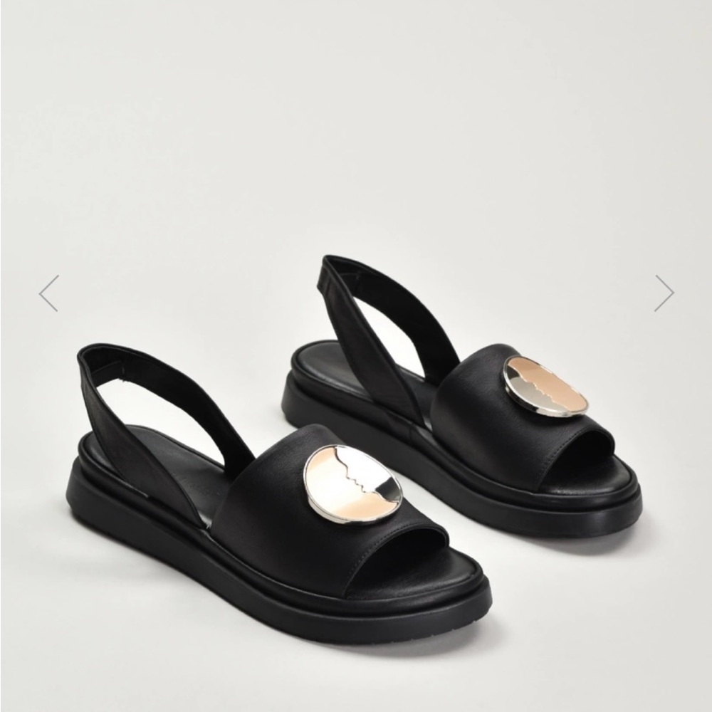 Sandal with coin